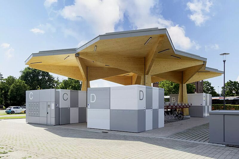 Fahrradgarage FULLERTON-E, 8 Anlagen mit jeweils 8 Boxen, doppelstöckig, Höhe x Breite x Tiefe 2885 mm x 3611 mm x 2100 mm, inklusive Zugangs- und Buchungssystem SmartBikeBox®, Stahlkonstruktion in RAL 9006 weißaluminium bzw. RAL 9003 signalweiß, Besch...