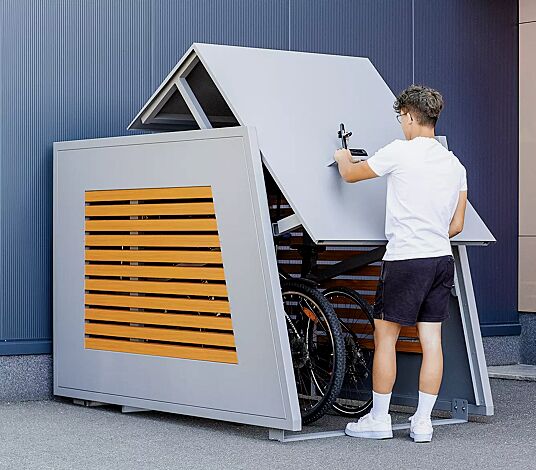 Fahrradgarage STYLEOUT® BIKEBOX LINIS, Seitenwände mit Lamellen in Holzdekor Douglasie, Aluminiumkonstruktion in RAL 9006 weißaluminium