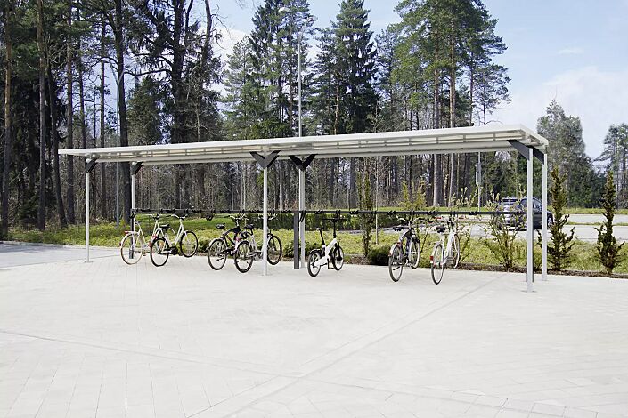 Fahrradüberdachung MATRIX Dachbreite x Dachtiefe 10090 mm x 2750 mm, einseitig, mit Lenkerhaltesystem UNIT, Stahlkonstruktion feuerverzinkt, Dachkassetten in RAL 9002 grauweiß, Stützenköpfe in RAL 7016 anthrazitgrau