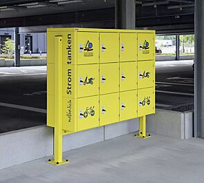 Schließfachanlage SECURE, 12 Schließfächer mit Elektroinstallation, Türschließung mittels Münzpfandschloss, inklusive Unterzug und Stützen zum Aufdübeln, Stahlkonstruktion in RAL 1018 zinkgelb, Beklebung bauseits