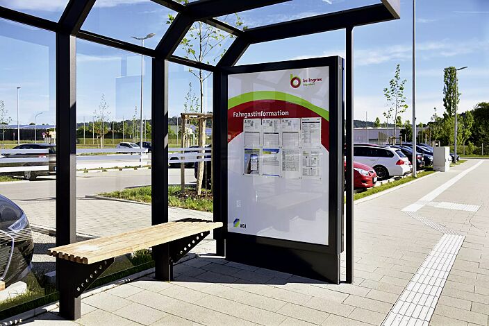 Werbevitrine CITY-LIGHT doppelseitig, mit Monofuß (Zubehör), in RAL 7016 anthrazitgrau, sowie Wartehalle SATURN und Sitzbank ARES